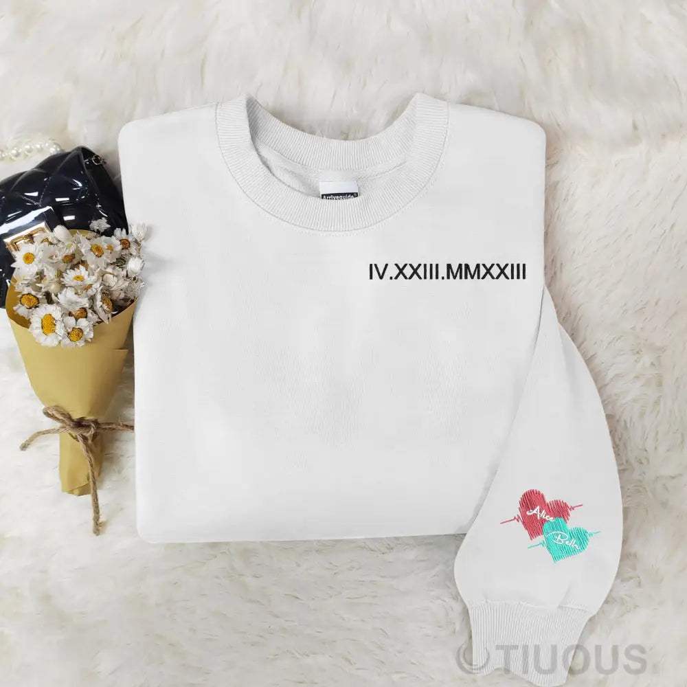 Customized Roman Numeral Embroidered Sweatshirts For Couples With The Names On Cuffs.